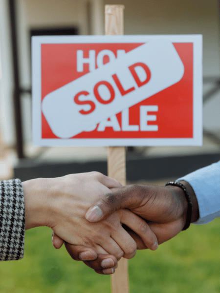 two people agreeing on a house sale